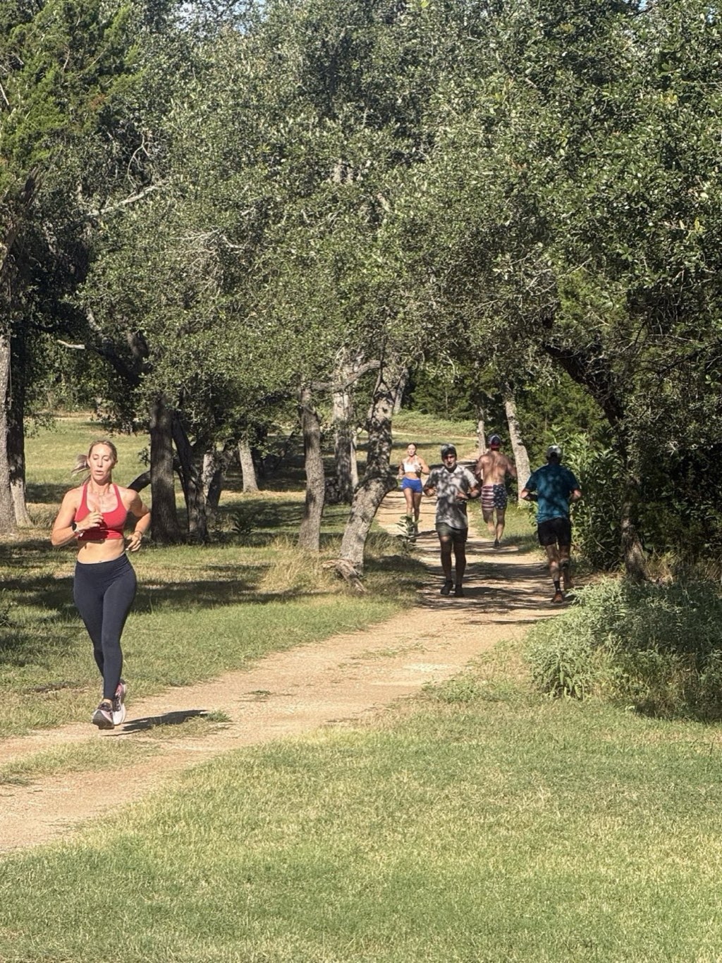 Members running the oak-lined trails at Ranch Fit Club